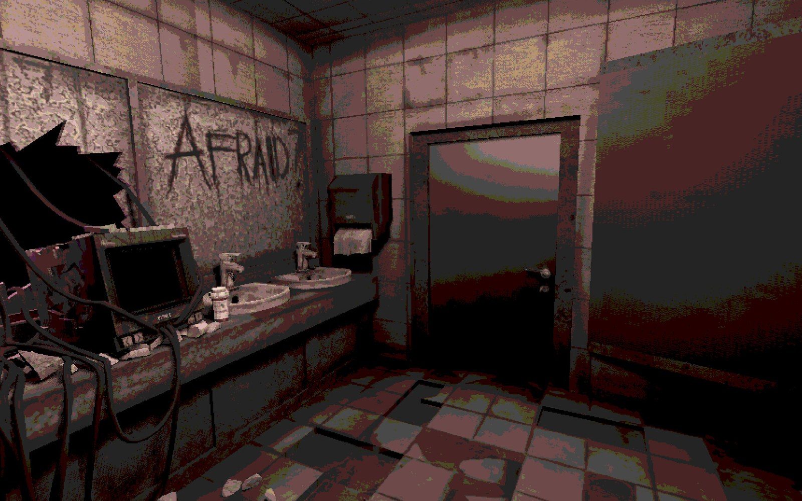 Grimy tiled bathroom with "afraid" scrawled on the mirror above a cracked sink