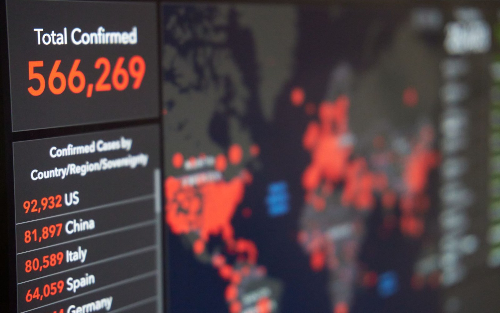 Screen displaying a world map with confirmed coronavirus case counts by country